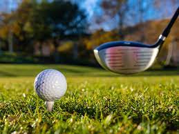A golf ball and golf club