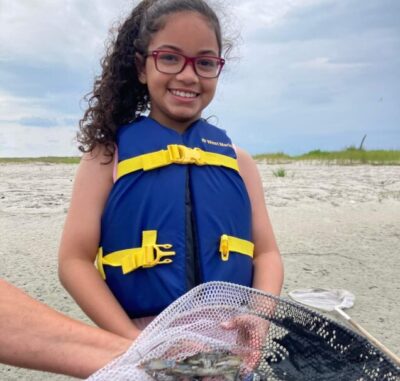 This student was all smiles during the day on the island. The crab didn't look as enthused.