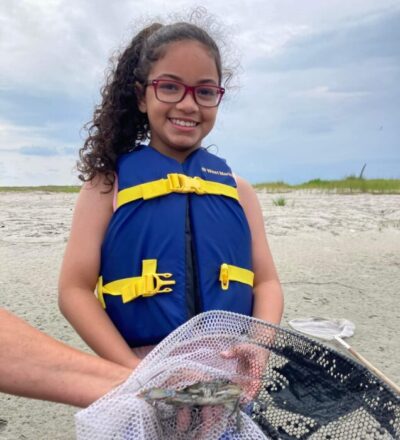 This student was all smiles during the day on the island. The crab didn't look as enthused.