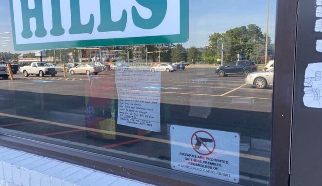 Contributed photo of a "no firearms" sign at an area Hills.