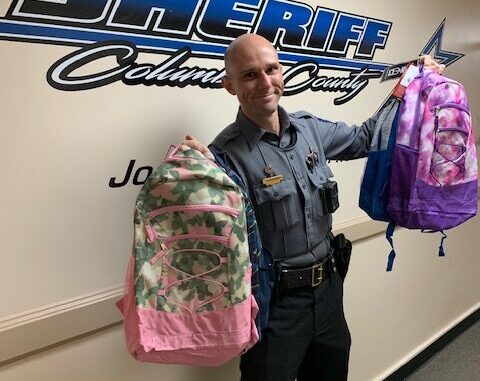 Deputies and SROs donated 40 backpacks to area school children last week. (CCSO photo)