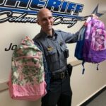 Deputies and SROs donated 40 backpacks to area school children last week. (CCSO photo)