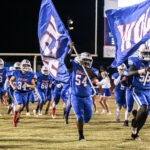 Football players with a flag