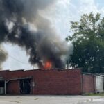 Firefighters from multiple departments are in Fair Bluff, trying to stop a structure fire from spreading to more buildings downtown.