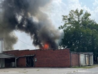 Firefighters from multiple departments are in Fair Bluff, trying to stop a structure fire from spreading to more buildings downtown.