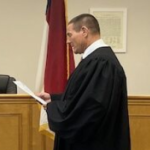 Ron Sasser is sworn into office.