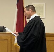 Ron Sasser is sworn into office.