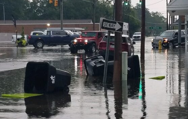 Madison Street was blocked downtown Wednesday when high water led to stalled cars and debris.