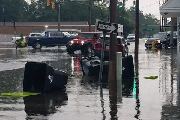 Madison Street was blocked downtown Wednesday when high water led to stalled cars and debris.