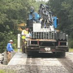 The wooden bridge on Roberts Road through the Green Swamp is being replaced with a more modern bridge with guardrails.