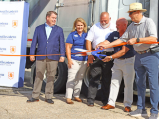 Rep. Brenden Jones, Angie Ransom, Scott Hartley, Dr. Chris English, and Fair Bluff town board member Randy Britt cut the ribbon for the new truck driving training school. (SCC Photo)
