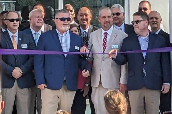 Members of the county school board, commissioners, Tabor School staff and Rep. Brenden Jones at Thursday's ribbon cutting. (Robert Nealy photo)