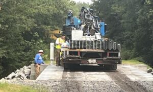 The wooden bridge on Roberts Road through the Green Swamp is being replaced with a more modern bridge with guardrails.