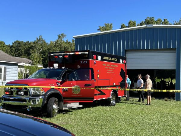 AN ADR ambulance crew picks up the bodies of the man and woman.