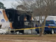 Investigators are trying to determine why this trailer near Hallsboro burned early Friday.