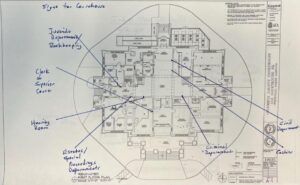 Layout of the first floor of the original courthouse, with handwritten notes about signage.