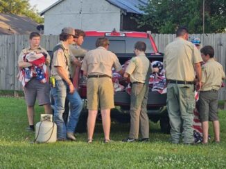 Members of two local scout troops helped with Friday's flag retirement ceremony. (Angela Norris photo)