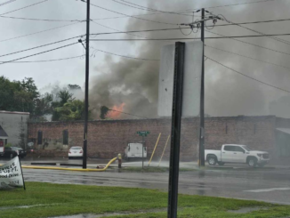 Flames break through the roof of a storage building behind the old ice house in Whiteville (Photos and video courtesy Glasgow Hicks)