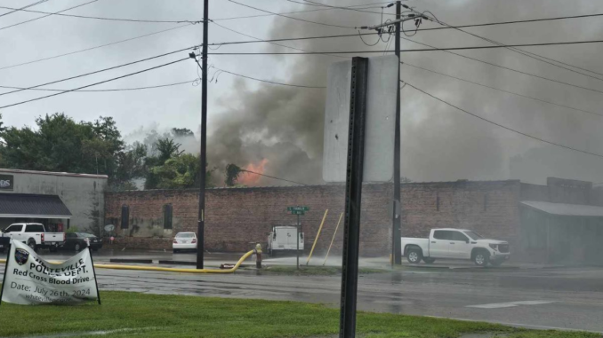 Flames break through the roof of a storage building behind the old ice house in Whiteville (Photos and video courtesy Glasgow Hicks)