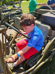 Lennox Norris checking out a WWII Jeep.