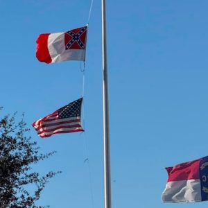 The flags before the Confederate flag was removed by police. Note the state flag is at half staff. (Contributed photo)