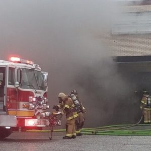 Firefightersprepare to enter the closed Radio Shack during Friday's fire.