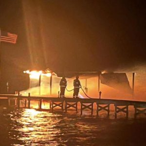 Firefighters spent hour on the scene of a pier fire at Lake Waccamaw Saturday morning. (Matt Wilson photo)