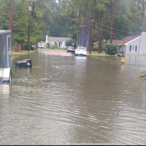 One of Whiteville's perennial trouble spots is again underwater this afternoon. East College and Mackenzie streets are blocked while crews attempt to clear a drain. More than three inches of rain fell in a brief period.  (Nathan Cawley photo)