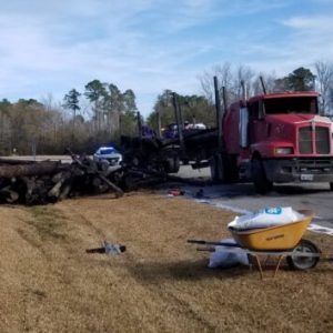 A logging truck rolled over and lost its load at U.S. 74 and Red Hill Road at Whiteville Friday morning.