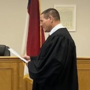 Ron Sasser is sworn into office.