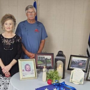 Tony and Sue Miller with the memorial table honoring their son, TCPD Patrolman Shane Miller.