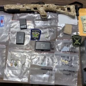 Drugs, cash and a firearm were seized after a raid in bolton. (CCSO photo)