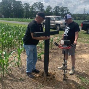Less than 24 hours after the original marker was stolen, Whiteville firefighters installed a new, temporary cross at the site of WFD Engineer Michael Stanley's fatal crash.