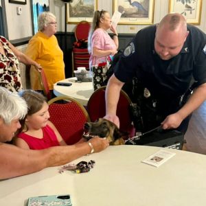 Vito makes a new friend during Tuesday's event (Anna Clewis Kennedy photo)