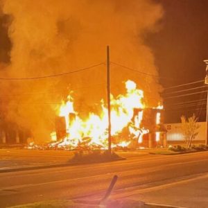 Flames shoot through the remains of one of the buildings at the Budget Inn early Wednesday. (Fire Marshal photo)