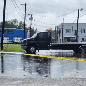 The Collision Repair Center blocked Walter Street with a wrecker to prevent water from being forced into the building by passing vehicles.