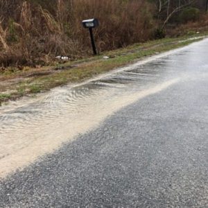 Rising water across the county is causing dangerous road conditions in many areas, such as this flooding along Peacock Road. (Submitted photo)